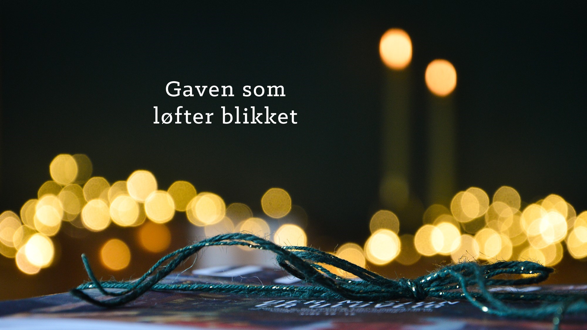 Tekstplakat med julegave, "Gaven som løfter blikket"